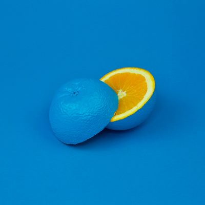 Ablue fruit cut open - inside its an orange